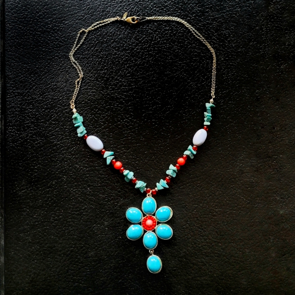 Beautiful blue turquoise and coral colored artisan chic floral necklace.